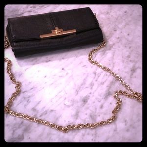 Black purse with gold chain
